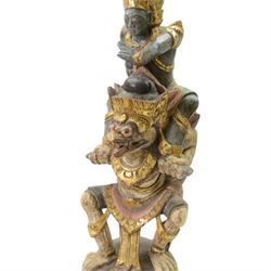 Hindu wooded sculpture depicting Vishnu riding on the shoulders of Garuda, H80cm