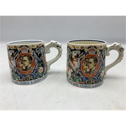 Two Dame Laura Knight coronation mugs for King George VI and Queen Elizabeth, comprising a Burleigh Ware example and a J&G Meakin example, each with a lion moulded handle and printed marks beneath, H8cm