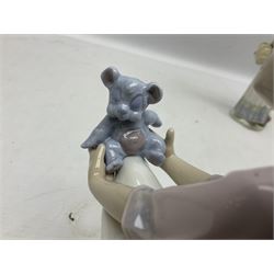 Three Lladro figures, comprising Garden Classic, signed no 7617, Summer Stroll no 7611 and Best Friend no 7620, all with original boxes, largest example H24cm 