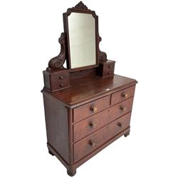 Victorian scumbled pine dressing chest, raised swing mirror in moulded frame with scrolled carved pediment, foliage S-scroll carved supports over trinket drawers, moulded rectangular top with rounded corners over two short and two long drawers, skirted base on turned feet, scumbled to resemble mahogany 