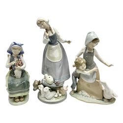 Three Lladro figures, comprising, Flower Harmonay no 1418, Milkmaid no 5718, and avoiding the goose no 5033, all with individual boxes, largest example H25cm 