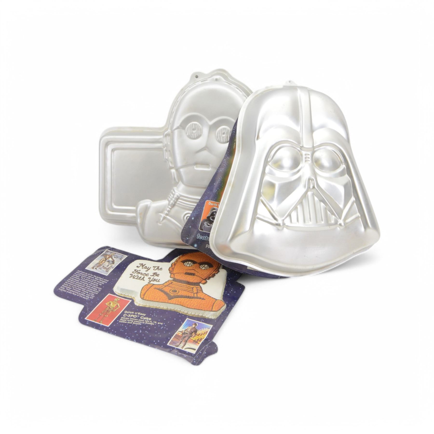 1990s Kinnerton Confectionary sealed Star Wars Advent Calendar, four Cadburys Star Wars Episode I chocolate tubes with figural lids, including Queen Amidala, Darth Maul, Anakin Skywalker and Jar Jar Binks, Topps Star Wars candy containers and 10 collectors cards and two Wilton Star Wars cake tins, C-3P0 and Darth Vader with inserts