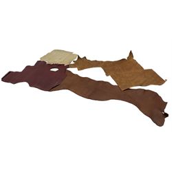Leather: approximately twelve skins to include large offcuts and part skins including red, tan, brown and black examples