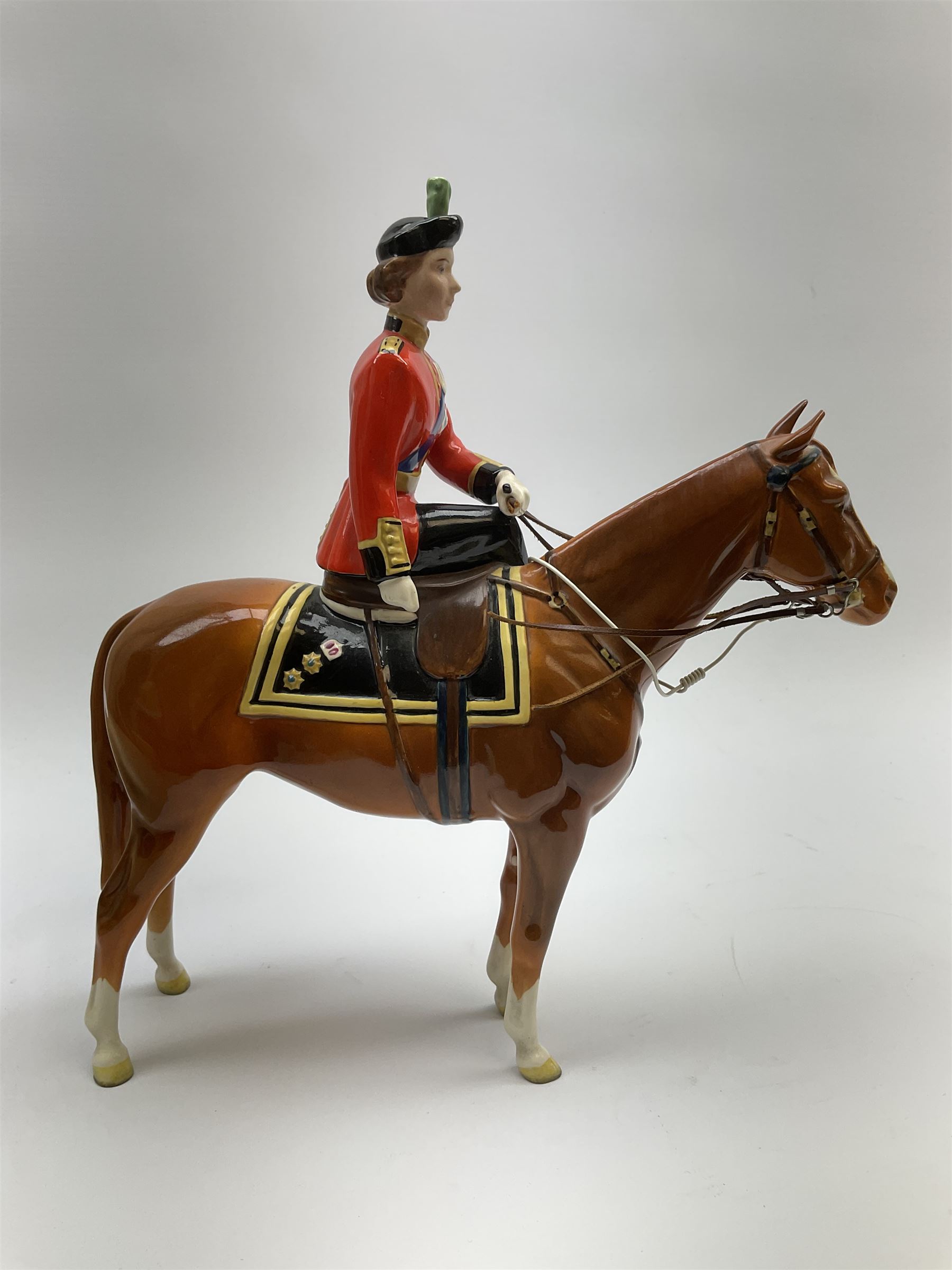 A Beswick model of HM Queen Elizabeth II mounted on Imperial Trooping the colour 1957, model no 1546, H26.5cm.