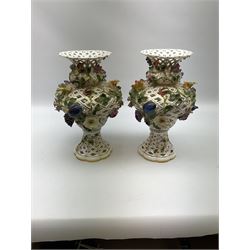 Pair of Meissen style pierced baluster vases, applied overall with fruit and flowering stems, possibly Samson, underglaze blue marks beneath, H33cm