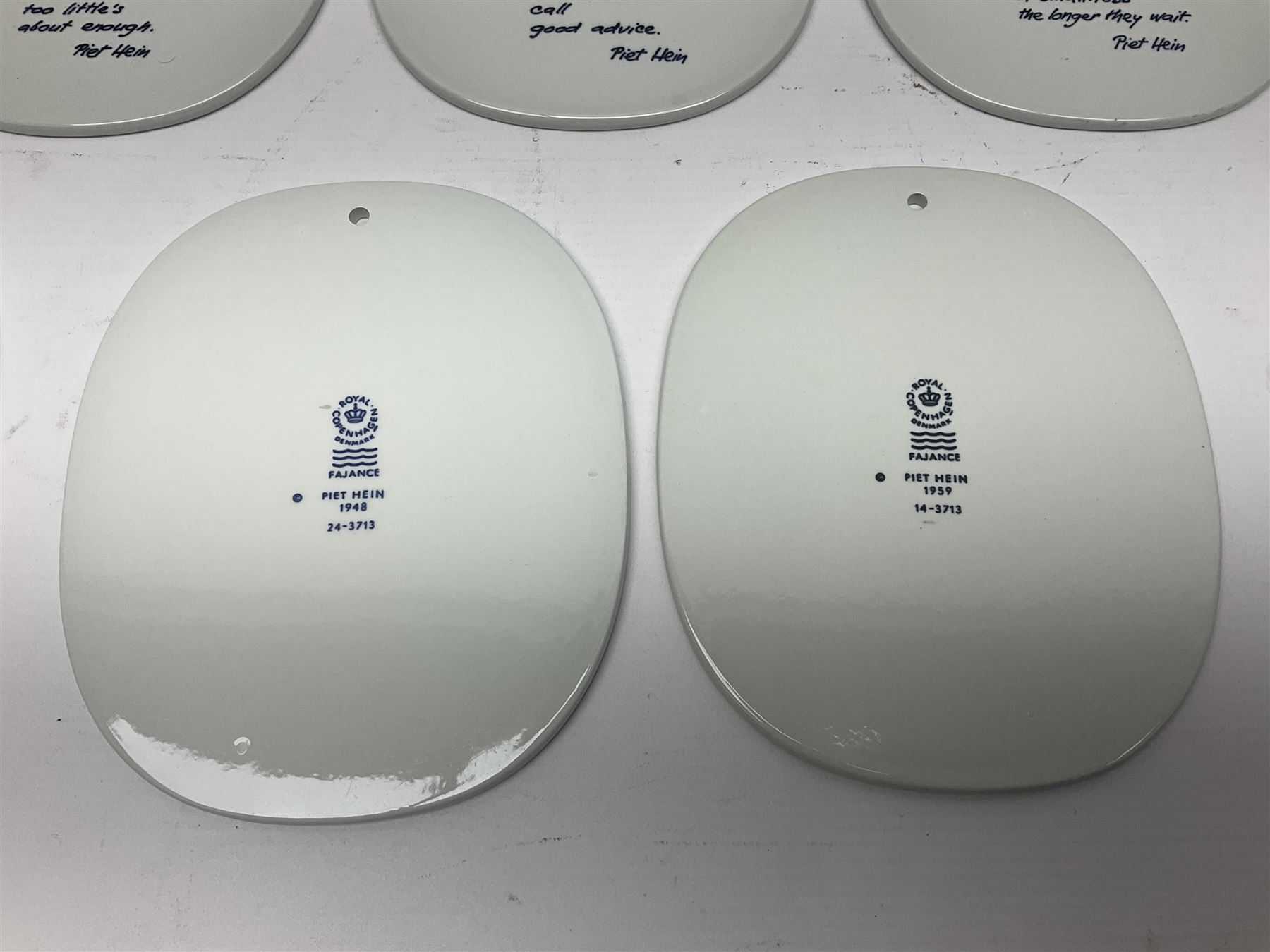 Seven Royal Copenhagen Piet Hein 1948-1980 plaques,all with printed mark to back H17cm