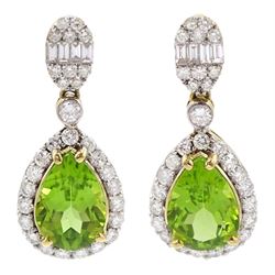 Pair of 18ct gold peridot and diamond pendant stud earrings, pear shaped peridot with diamond surround, suspended from cluster of baguette and round brilliant cut diamonds, total peridot weight 4.58 carat, total diamond weight 1.21 carat, with Wold Gemological Institute Report