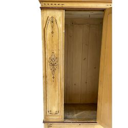19th century painted pine wardrobe, the projecting cornice over mirror glazed door, with painted decoration depicting scrolling foliate and urns, drawer to base on skirt