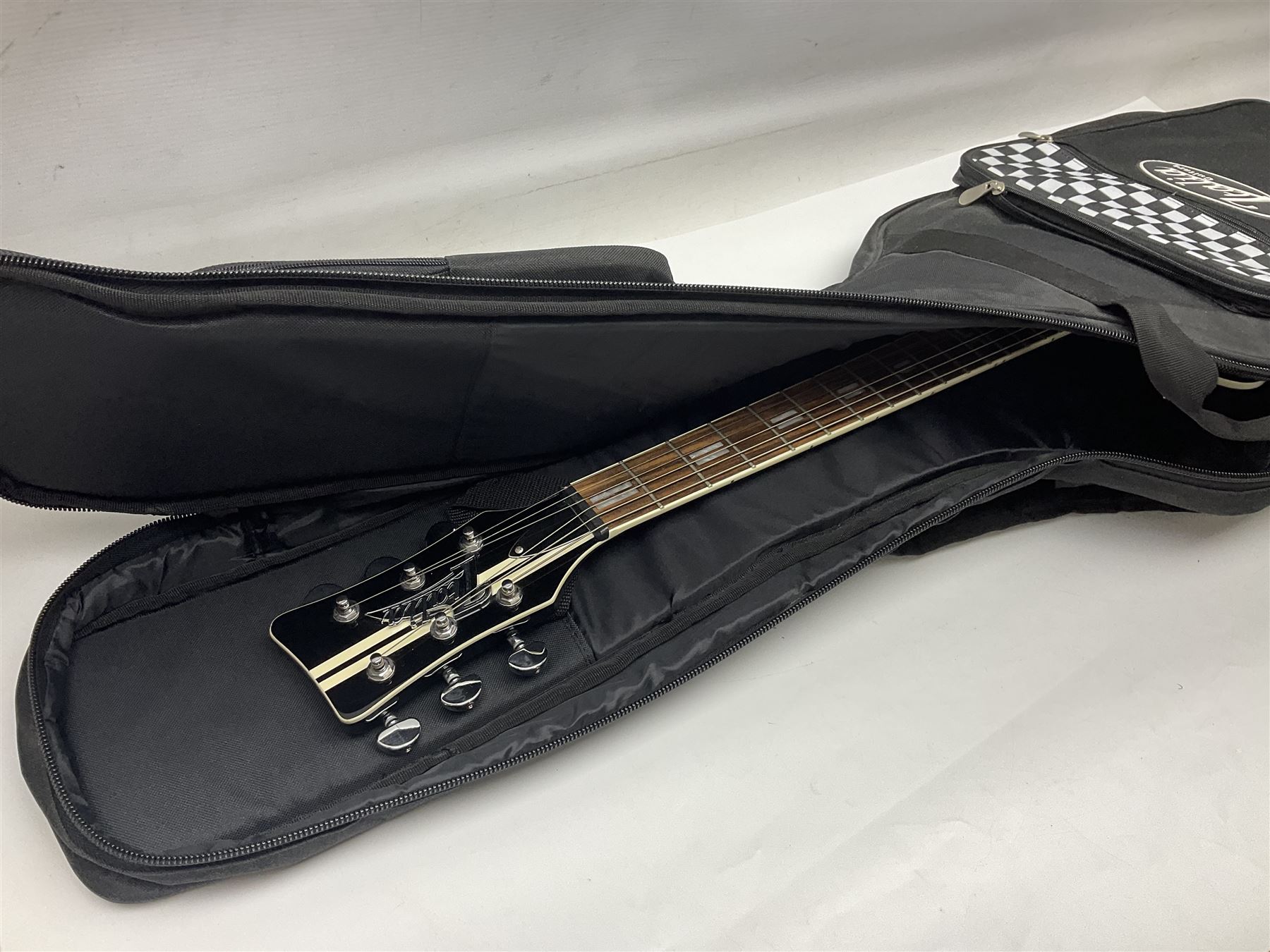 Italia Maranello Speedster electric guitar in black and white, serial no.013972; L99cm; in Italia soft carrying case; together with a boxed TGI 3491 guitar stand