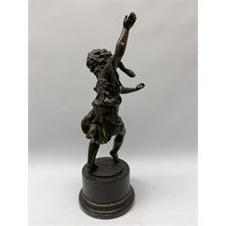 After E Plat, bronze modelled as a dancing child, signed E. Plat, upon cylindrical black marble base, H40cm