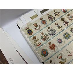 Large poster entitled 'Crests and Badges of the British Army in Daily Use 56 x 86cm; together with twenty-five colour prints of military interest including Crimean War, Boer War, WW2 etc; various sizes; all unframed