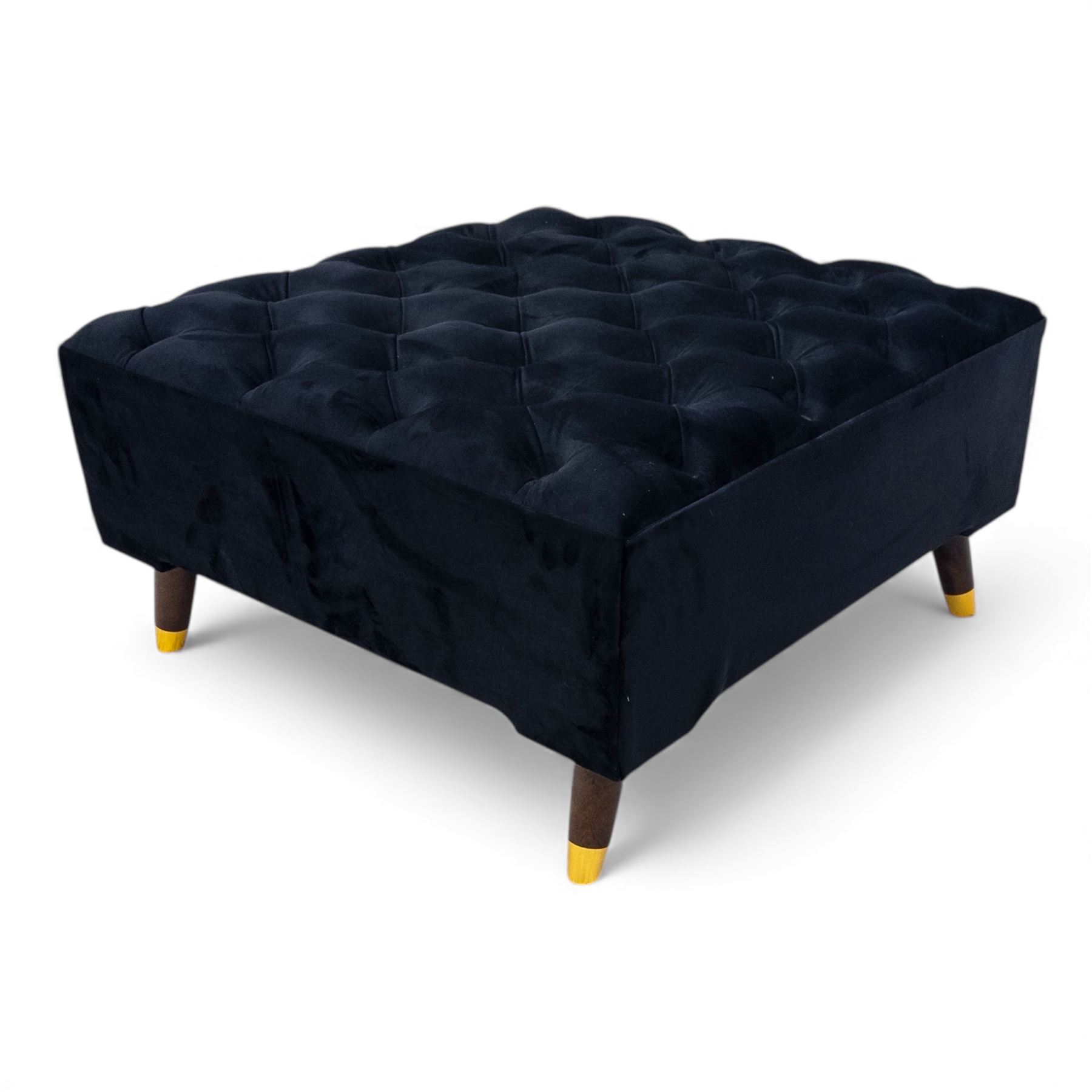 Late 20th century pair of Empire inspired brass metal framed two-seater sofas, upholstered in black velvet with cylindrical backrest and sphinx form arms terminating in paw feet, together with matching deep buttoned black velvet footstool on brass capped legs (Footstool H 38cm, W 70cm, D 70cm)