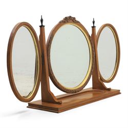 And So To Bed - 'Louis XV' triple dressing table mirror, central circular bevelled mirror, enclosed by parcel gilt with carved edge, flanked by two oval mirrors, the base with a well for trinkets 