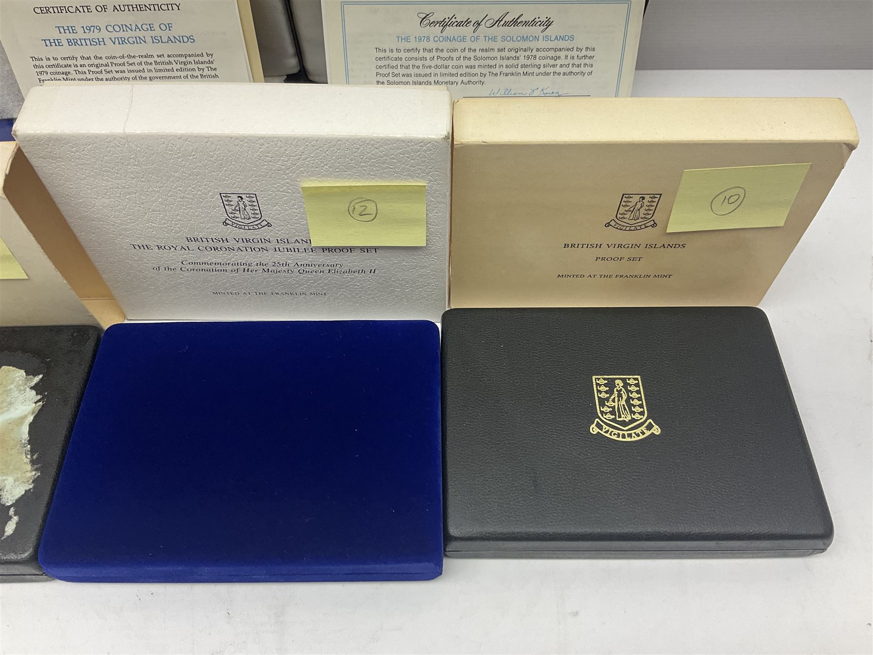 Four British Virgin Islands proof coin sets, comprising First Coinage of the British Virgin Islands 1973 proof six coin set, containing silver one dollar coin, 1977 and 1979 proof sets, containing high denomination silver coins, and The Royal Coronation Jubilee 1977 six coin silver proof set, each minted at the Franklin Mint, all cased with certificates, and a Solomon Islands 1978 proof seven coin set, containing silver five dollar coin, minted at the Franklin Mint, cased with certificate (5)