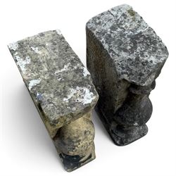 Pair of George III weathered carved sandstone architectural corbels, each with a projecting moulded capital above a half-canted baluster, waisted socle and stepped base