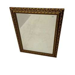 Rectangular wall mirror in leaf moulded bronze/gilt frame, bevelled plate