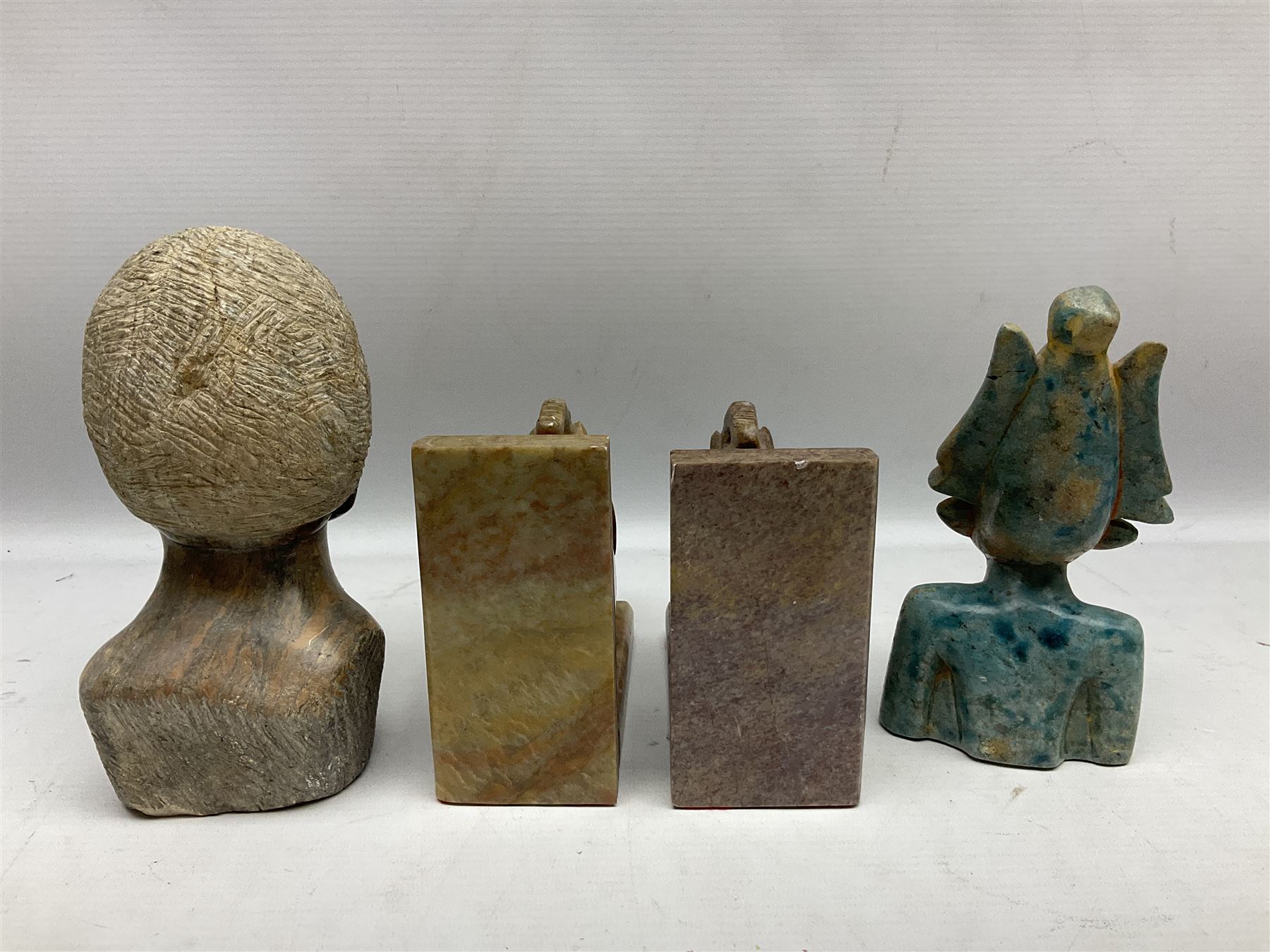 Pair of soapstone figural bookends carved with elephants, African soapstone bust, Buddha bust, Egyptian style etc, tallest H18cm