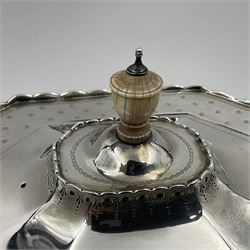 Victorian silver four piece tea service, comprising teapot, teapot stand, twin handled open sucrier and milk jug, each of octagonal form with foliate bud border and engraved decoration including crest to canted panels, and vacant panels, the teapot with ivory finial to the hinged cover and later wooden handle, hallmarked Edward Barnard & Sons Ltd, London1896, teapot including finial H15cm, milk jug including handle H16cm, teapot stand W11.5cm

This item has been registered for sale under Section 10 of the APHA Ivory Act