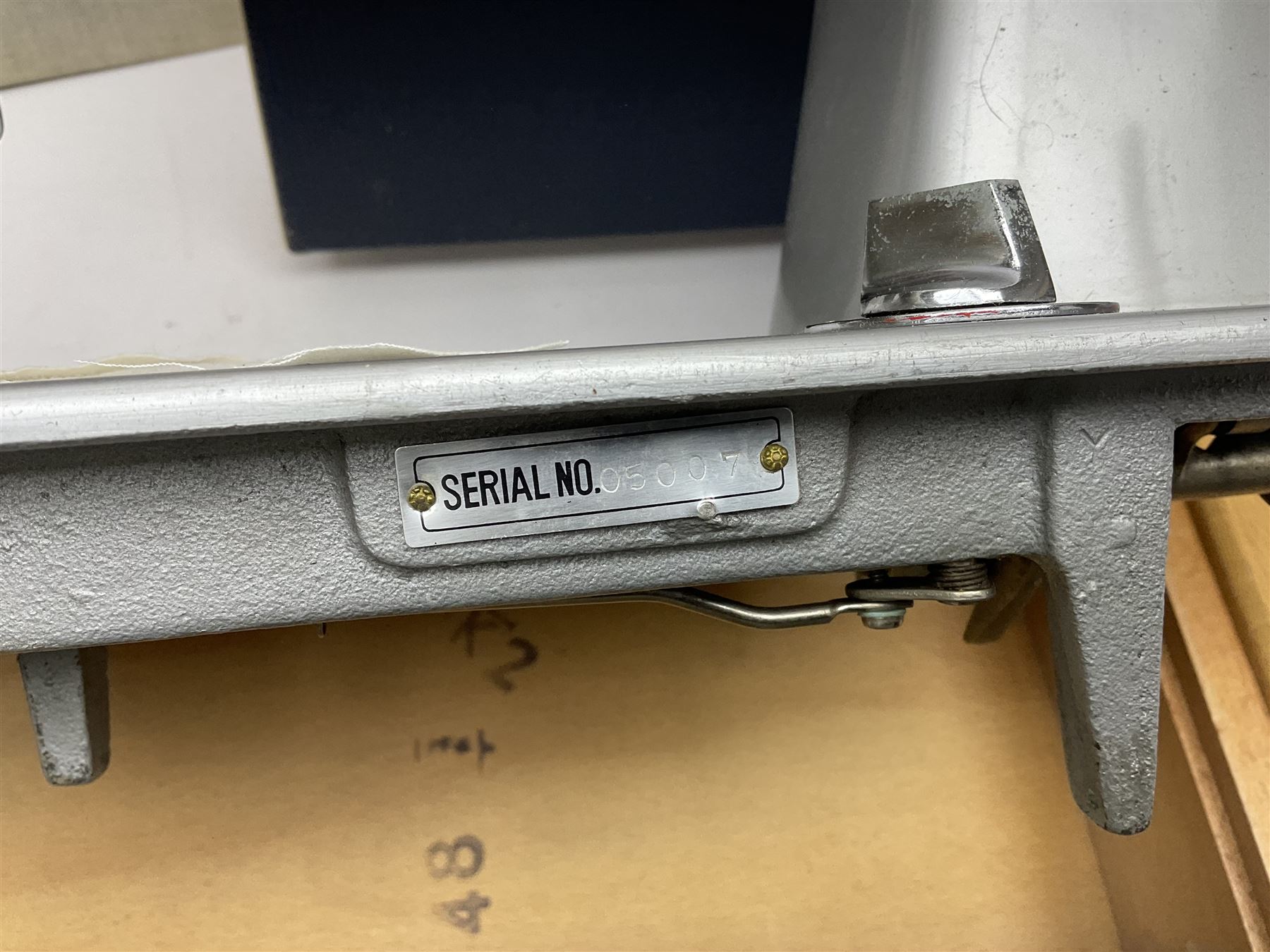 Seamstress sewing machine in case, together with a Singer sewing book