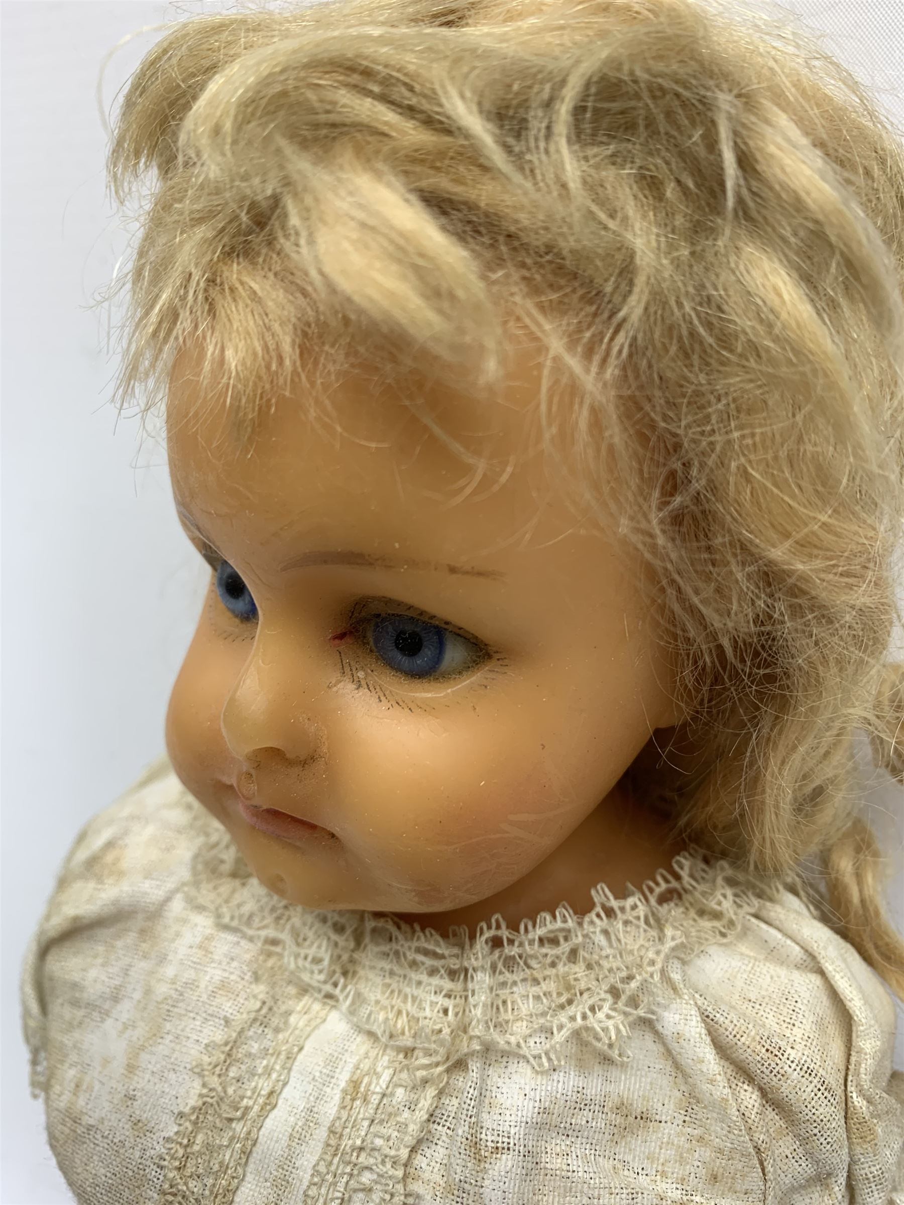 Early 20th century Cuno and Otto Dressel wax shoulder head doll with applied hair and fixed glass eyes, soft body with jointed composition lower limbs, maker's stamp to right thigh, clothing and box H38cm in original box