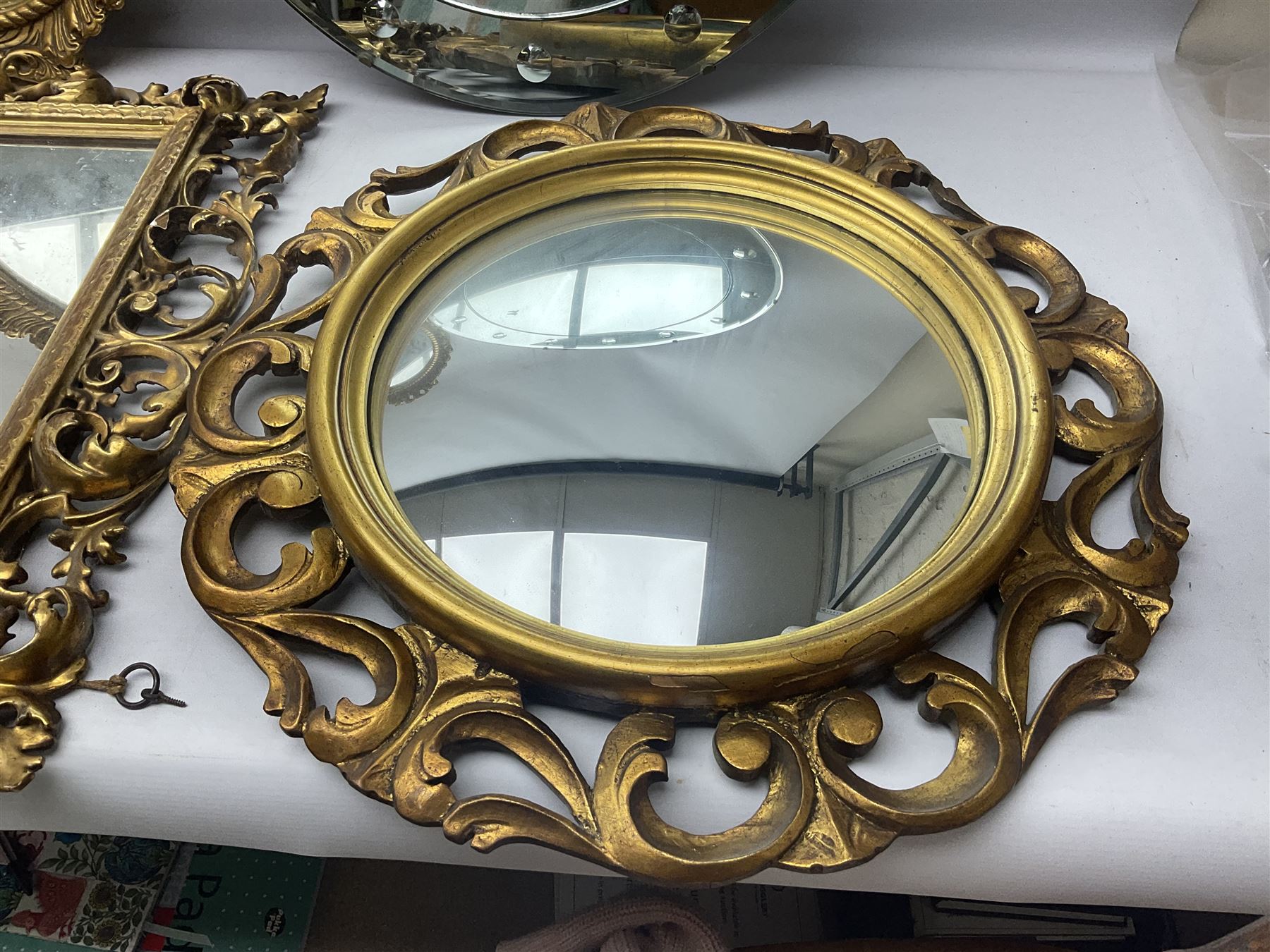 Three Rocco style gilt mirrors, together with another mirror, largest example H64cm 
