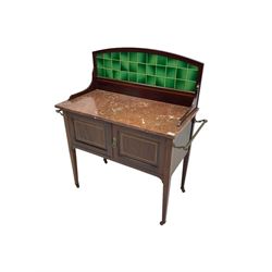 Edwardian inlaid mahogany washstand, raised back with emerald green tiles over marble top, fitted with two panelled cupboard doors, raised on square tapering supports on ceramic castors