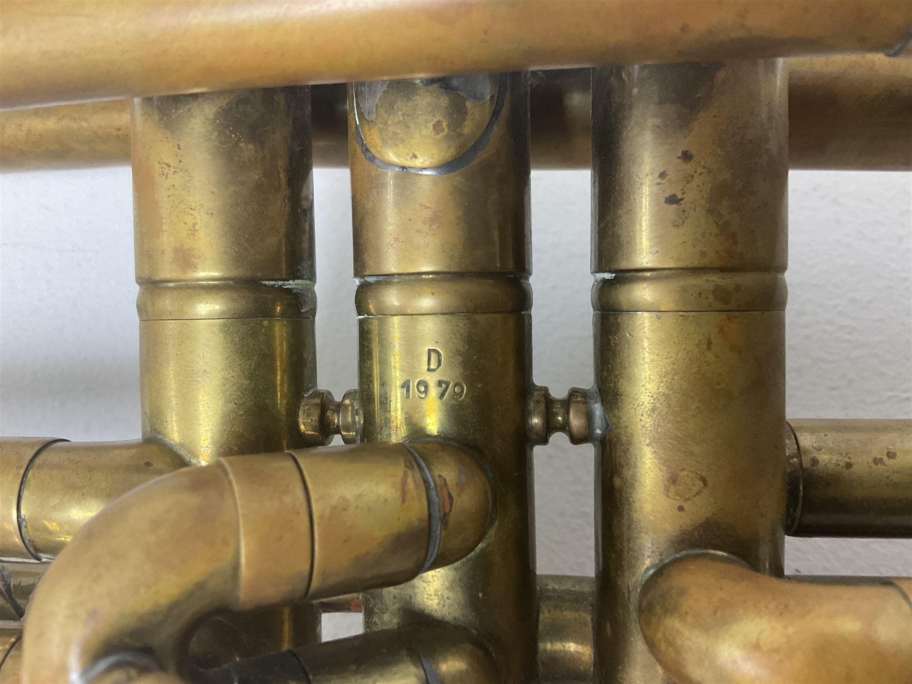 Three brass trombones comprising Elkhart Ind. USA 'CONN' model no.72H; Besson 'Concord'; and Selmer Distributed 'Lincoln'; two in carrying cases; and German B & M 'Champion' brass trumpet (4)