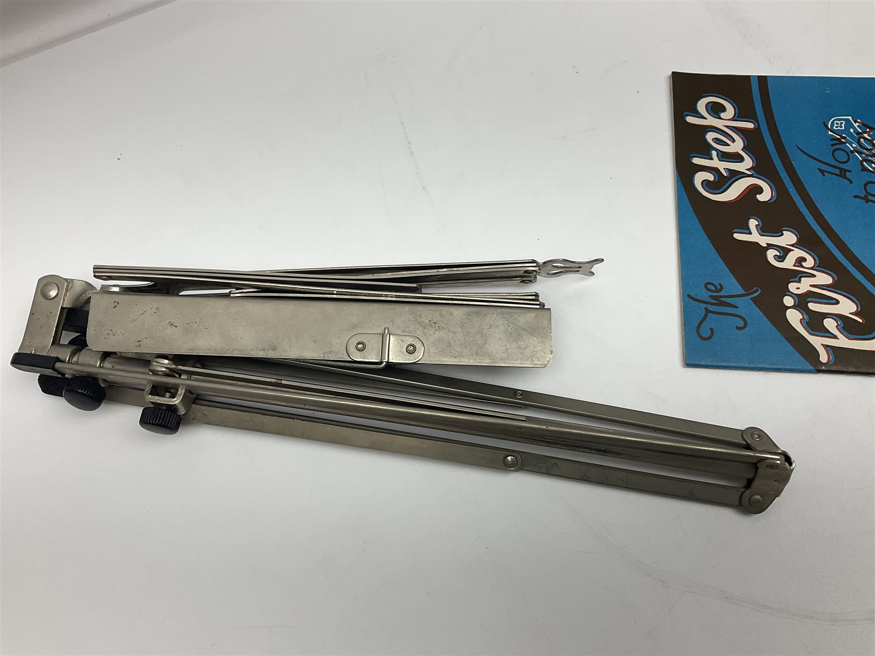 Late 19th/early 20th century Italian lute back mandolin with segmented back and spruce top; bears maker's label for Pietro Tonelli Napoli; together with a mandolin instruction booklet and a folding music stand L60.5cm