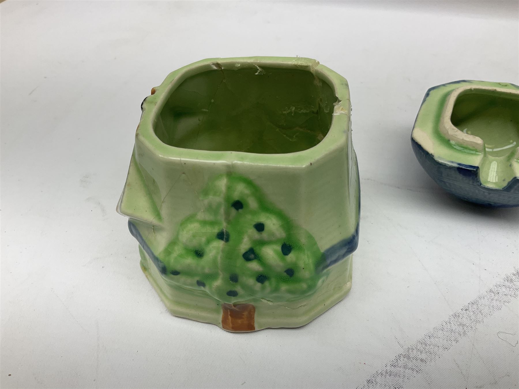 Collection of Japanese Maruhon ware novelty preserve pots, to include examples modelled as a windmill and cottages, together with other 1920s and 30s Art Deco style preserve pots, etc