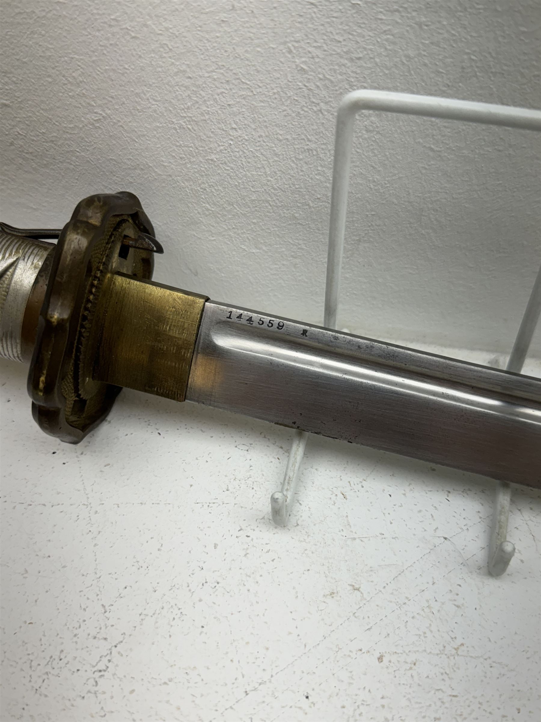 WWII Japanese katana with cast pierced tsuba, the L69cm arsenal steal blade marked 144559, with black lacquer Saya (scabbard), L97cm overall