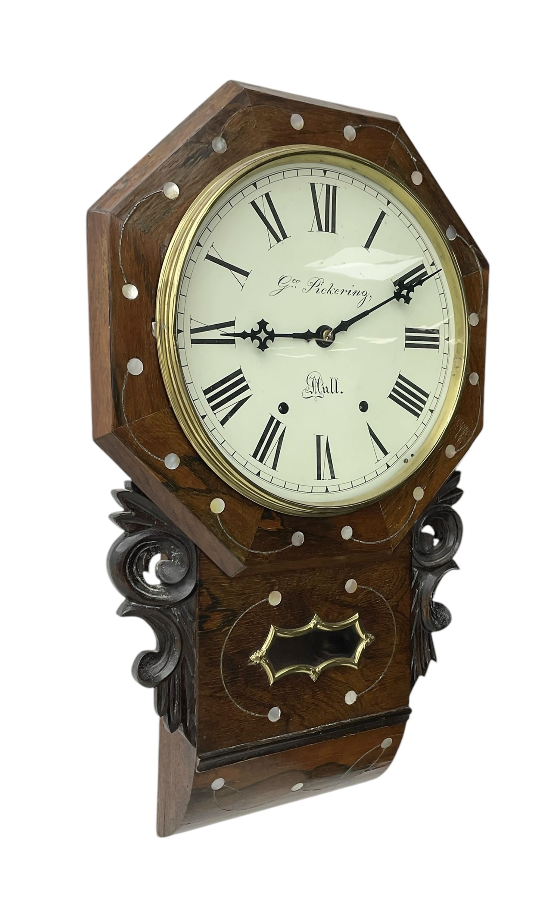George Pickering of Hull - 8-day American mahogany and mother of pearl inlaid drop dial wall clock c 1880, with an octagonal dial surround and spun brass bezel, painted dial with Roman numerals, minute track, retailers name and Maltese cross hands, case with an ogee base, carved ears and pendulum viewing glass, twin train spring driven movement striking the hours on a bell.  With key and pendulum.