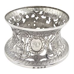 Edwardian Irish silver dish ring, of circular waisted form, embossed and pierced throughout with scene of figures, birds, cattle and buildings amidst C scrolls, hallmarked James Wakely & Frank Clarke Wheeler, Dublin 1906, upper rim D10cm, approximate weight 4.11 ozt (128 grams)