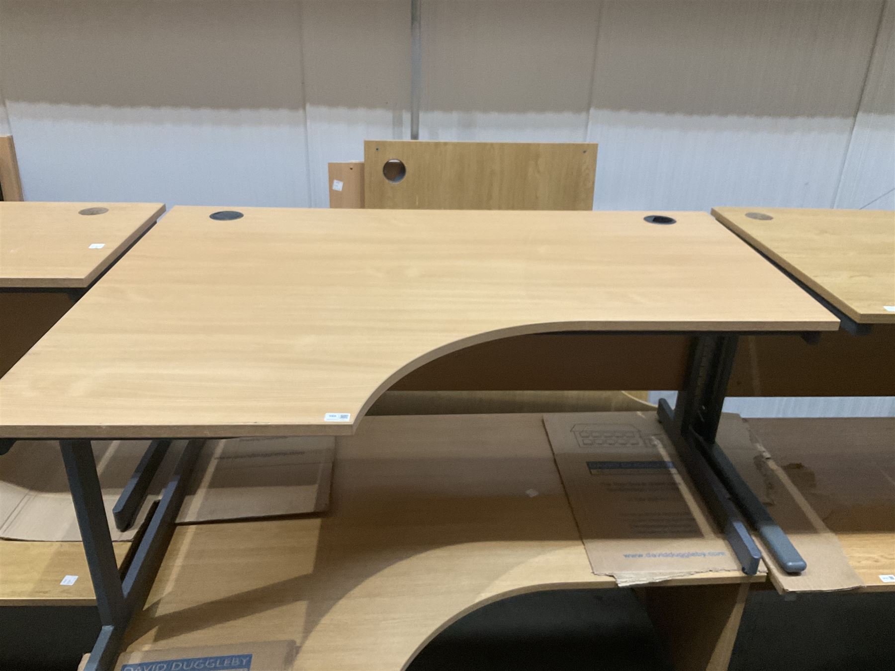 Pair of left hand return oak effect office desks. THIS LOT IS TO BE