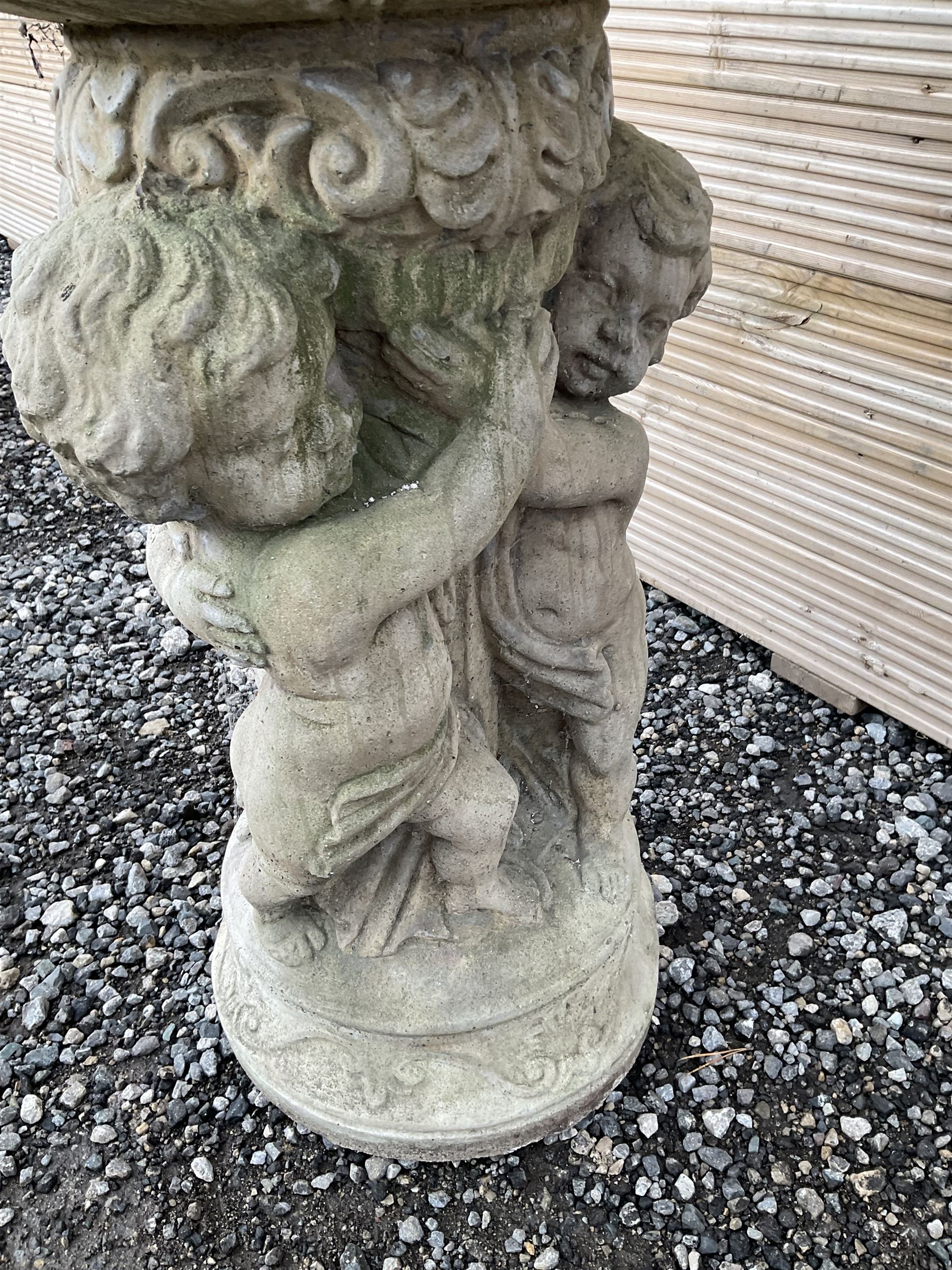 Cast stone planter or bird bath, supported by classical putti on circular base - THIS LOT IS TO BE COLLECTED BY APPOINTMENT FROM DUGGLEBY STORAGE, GREAT HILL, EASTFIELD, SCARBOROUGH, YO11 3TX