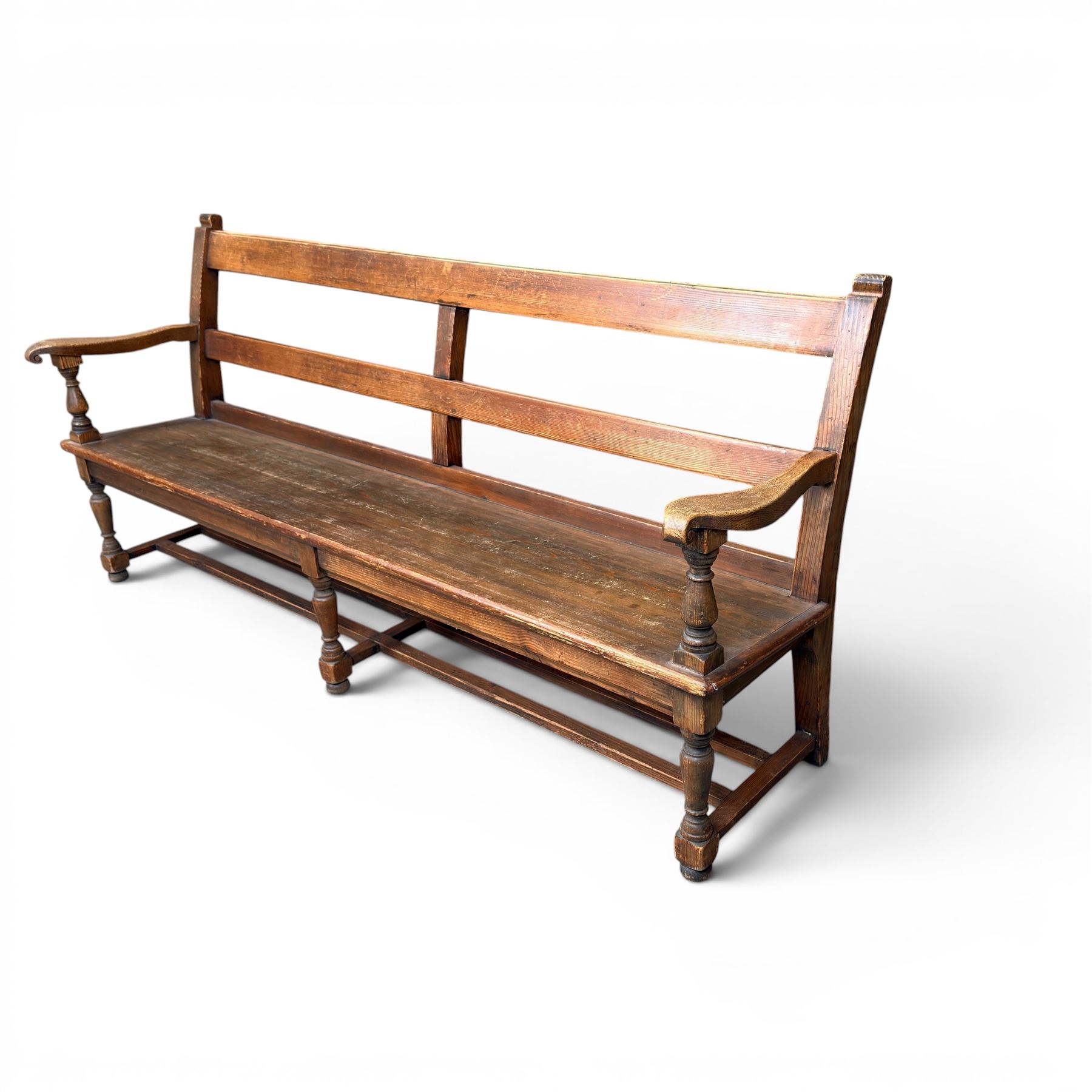 Early 20th century pine and oak bench seat, stained pine rail back frame with shaped oak arms