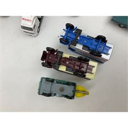 Corgi - eighteen unboxed and playworn/repainted die-cast commercial vehicles including Commer 5-Ton Wagon with drop-side trailer and two other 5-Ton wagons, Dodge Key Fargo, Jeep FC-150, two London Routemaster buses, Carrimore Trideck Transporter, two Carrimore Mark IV Transporters, Carrimore Low Loader, Ecurie Ecosse Racing Car Transporter etc (18)