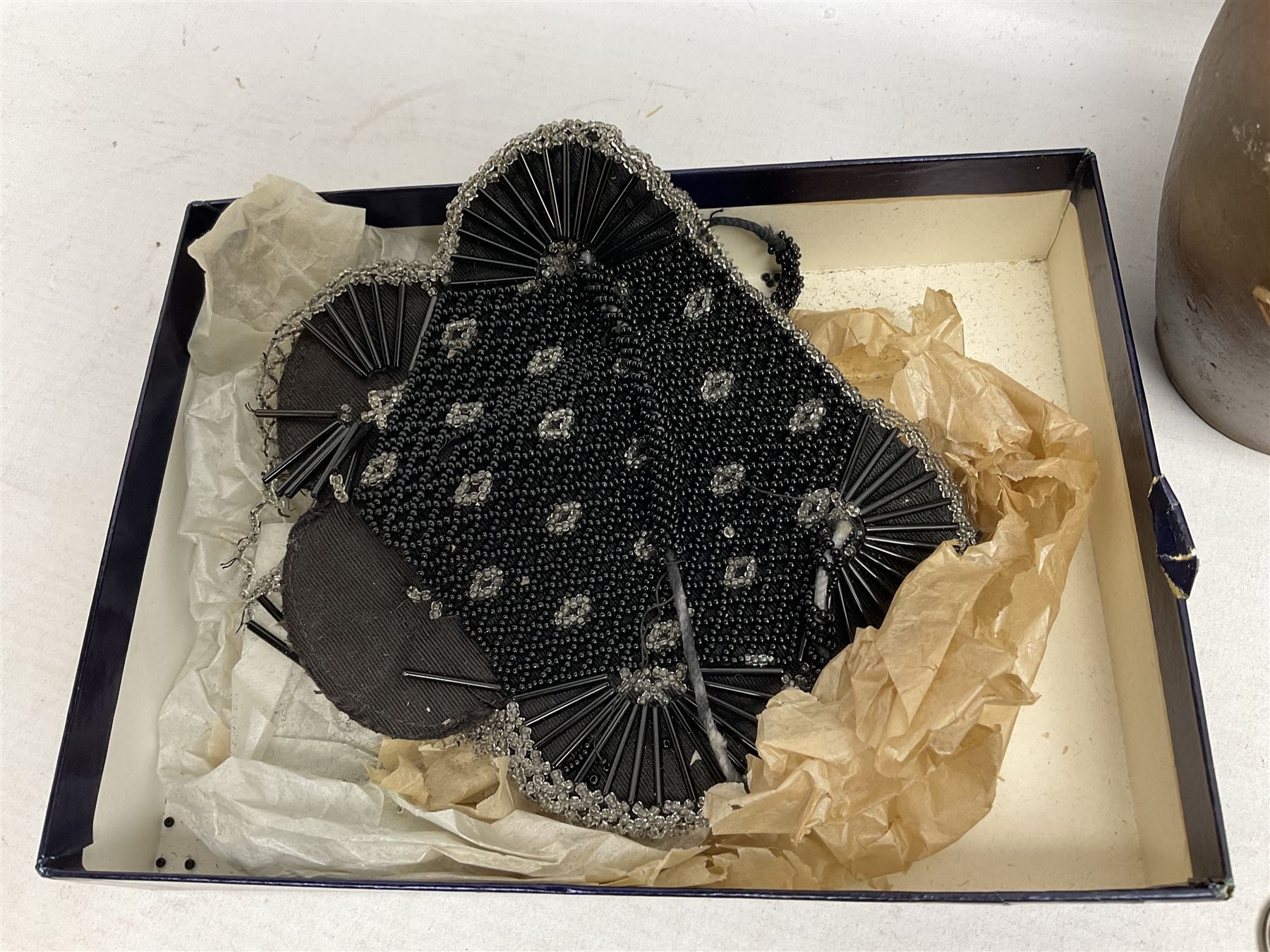 George V silver evening purse, the body of rectangular form with engraved decoration of swags and suspension chain, hallmarked G & C Ltd Birmingham 1918, together with Art Deco black beaded ladies bag (a/f), pair of hallmarked silver cufflinks, hallmarked silver bow brooch, 19th century portable inkwell, Victorian padlock stamped with the crown VR, etc