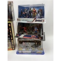Three Disney Store Marvel Avengers Deluxe Figurine Sets; Spiderman Walkie-Talkie Set; Schleich Batman v Superman action figure Set; and Angus Young of AC/DC action figure; all appear mint in unopened boxes (6)