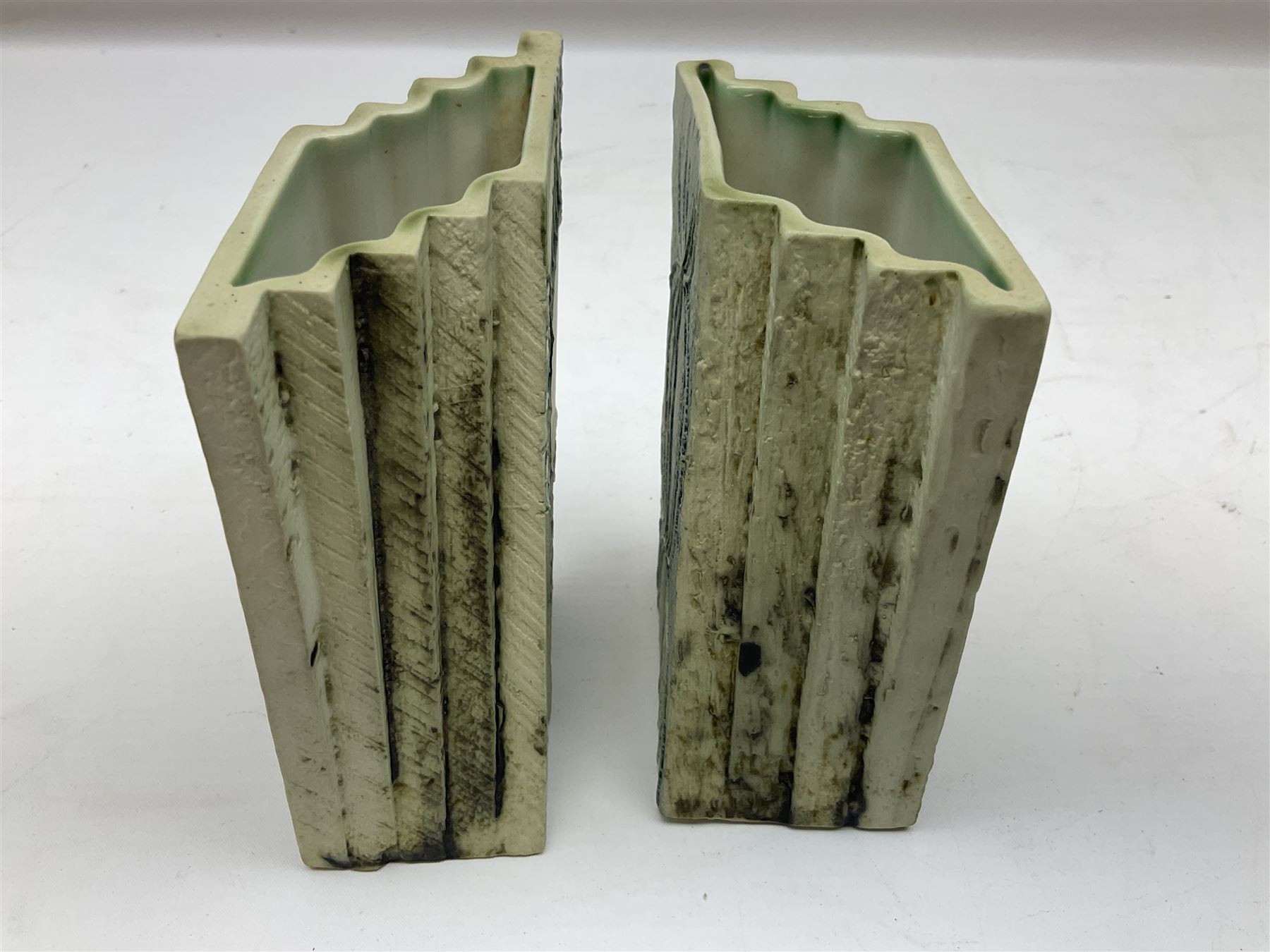 Pair of Carn Pottery Penzance vases of fan form, with tube lined floral and stylised decoration, stamped and marked X9 to base, H11.5cm