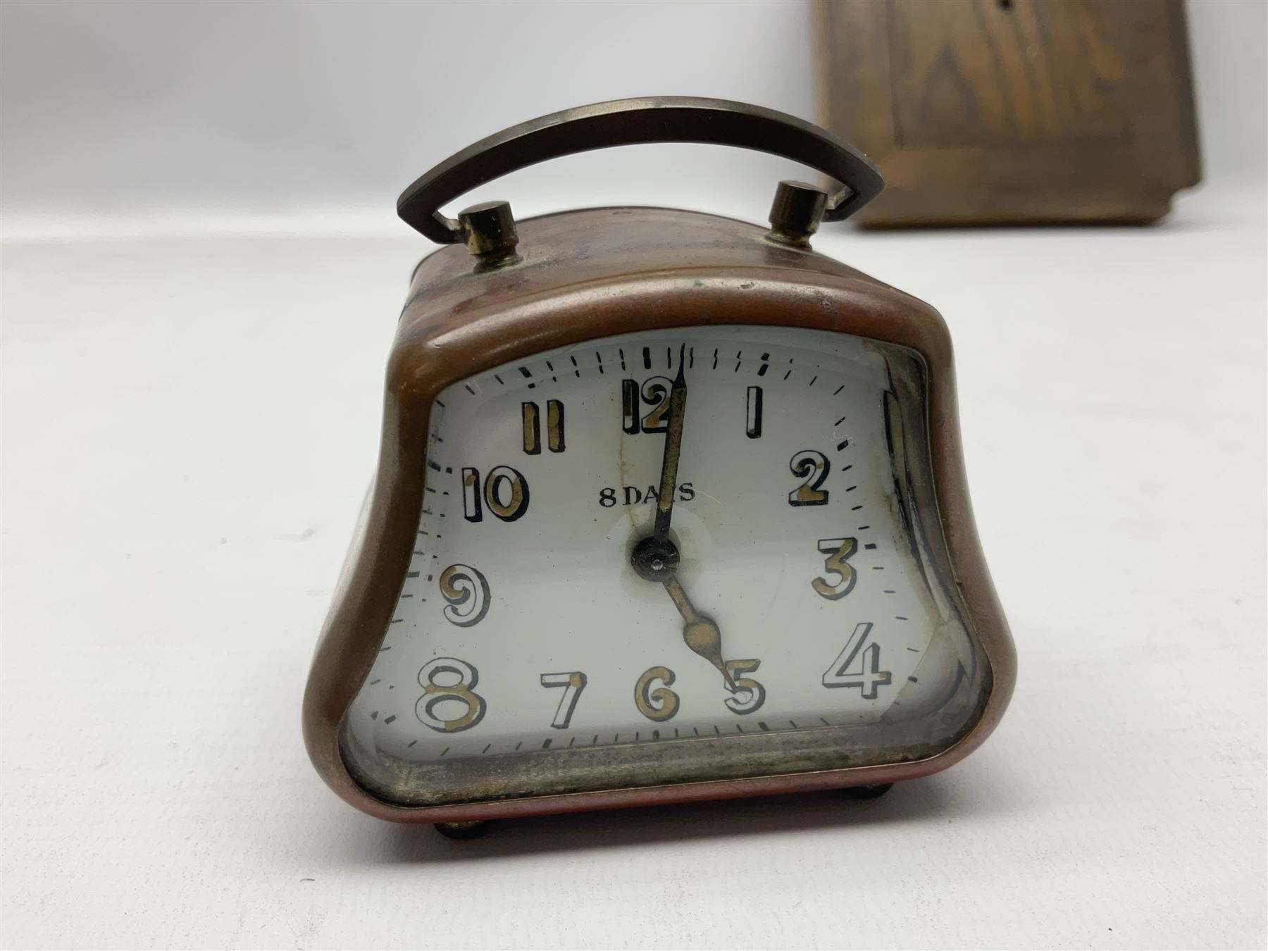Smiths barometer in carved and stepped oak square case, together with a small copper 8 days clock with bevelled glass plate