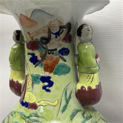 20th century Chinese Famille Rose vase, of baluster form with flared lobed rim and twin figural handles, decorated in polychrome enamel with figures dancing and playing instruments within a garden setting, H42cm