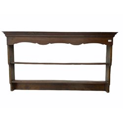 George III oak plate rack, two open shelves, shaped frieze
