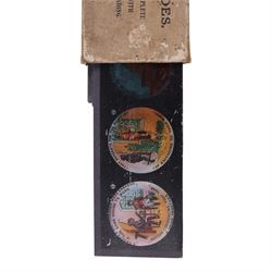 Collection of 9.5mm and 16mm cine film reels, mostly silent black and white with some notched examples, including 'Antarctic Whale Hunt' with sound, 'White Flame', 'The Good Old Days' electricity promotional, 'Rolling Around' Charlie Chaplin, etc, most in tin cases with hand written titles, together with two boxed sets of lantern slides, 'The Transvaal War', 'The Sweep & The Whitewasher' and 'Willies Revenge'