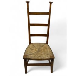 Attributed to William Birch of High Wycombe - Arts & Crafts oak ladder-back side chair, with turned finials, rush seat, and stretchers, raised on square-section supports; 19th century mahogany Pembroke table, rectangular drop-leaf top raised on turned supports with central stretcher and splayed feet