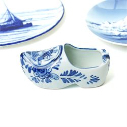 Royal Copenhagen onion pattern low comport, three breakfast cups and five saucers, oval platter, four tea plates, Munich 1972 Olympics plate, and four other blue and white items