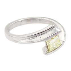Platinum diamond ring, tension set with a single princess cut fancy yellow diamond of approx 0.60 carat, hallmarked