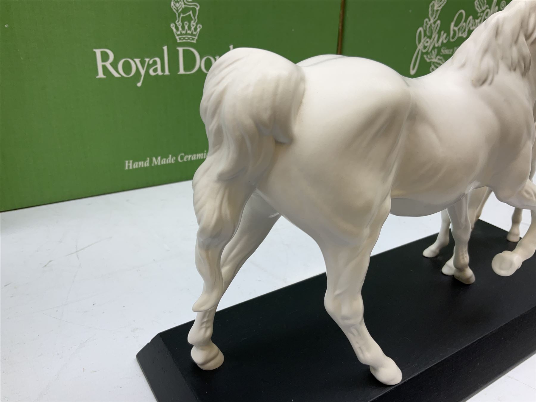 Five Beswick and Royal Doulton horse figures in matt white on black plinths, comprising of  Spirit of Affection no. 2689/2536, Springtime no.2837, Spirit of peace no.2916, Spirit of earth no.2914 and Spirit of the wild no. 183, together with a composite figure of a horse (6)