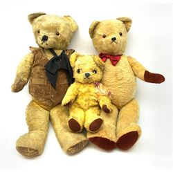 1950s English large wood wool filled teddy bear with swivel jointed head, glass type eyes and vertically stitched nose and mouth and jointed limbs with rexine paw pads H33