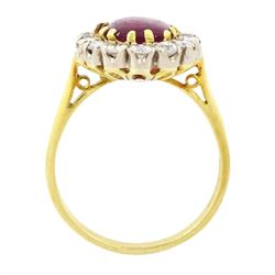 18ct gold garnet and diamond cluster ring, single cabochon cut garnet surrounded by twelve brilliant cut diamonds, London 1970, total diamond weight approx 0.60 carat 