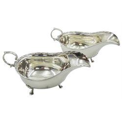 Pair of early 20th century silver sauce boats, each with flying scroll handle, bead and dart rim, upon three hoof feet, hallmarked Cooper Brothers & Sons Ltd, Sheffield 1912, approximate total weight 5.85 ozt (182 grams)